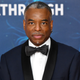 Levar Burton in a nice suit and smiling while at an award show.
